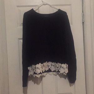 Navy blue sweater with white lace trim